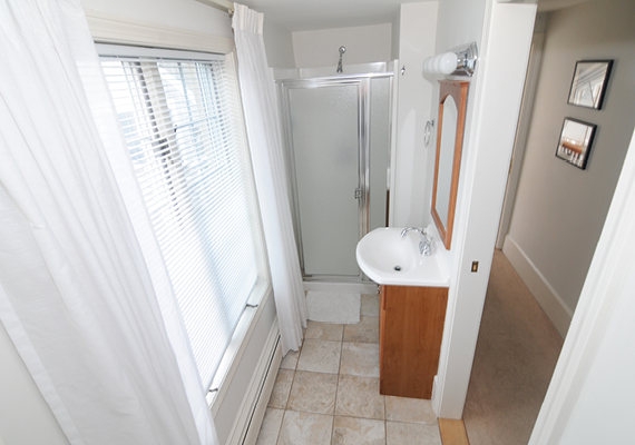 Waterfront 3+ Bed, 2 Bath Apartment. Includes waterfront balcony with seating for 4, fully stocked kitchen, full dining room seating for 8, full living room with harbor and beach views, media room with fireplace, air conditioning and heating, WiFi, iHome, Comcast TV/DVD.